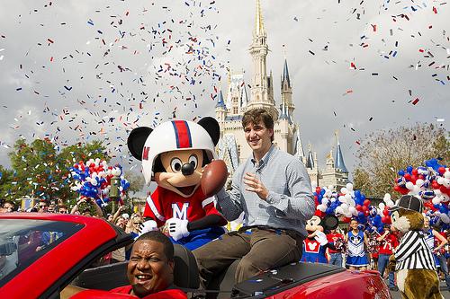 New York Giants quarterback and Super Bowl XLVI MVP  Eli Manning takes a celebratory ride with Mickey Mouse on Monday at Walt Disney World.