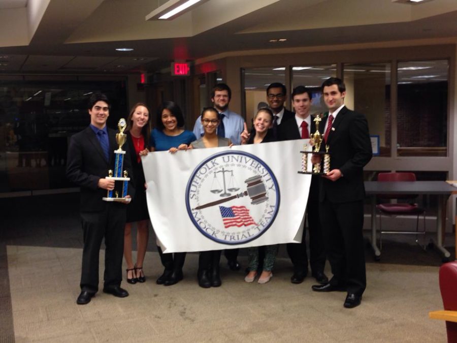 The 2013 Mock Trial Team posing with its trophies
(Photo courtesy of Mock Trials Facebook)