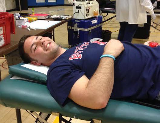 Senior Michael Guay donating blood on campus Tuesday.
(Photo by Sam Humphrey)