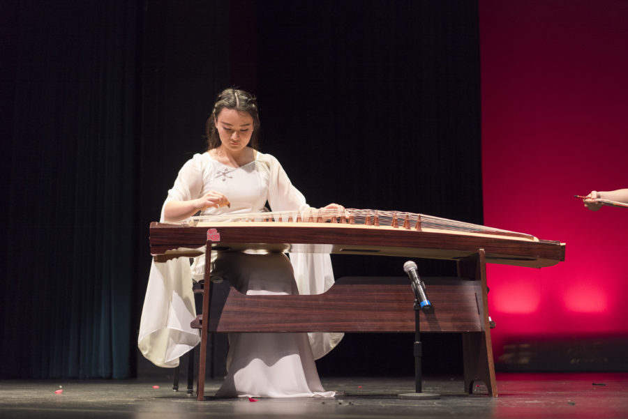 Performer plays the ancient Chinese instrument Guzheng. 
By Vincent Lin 