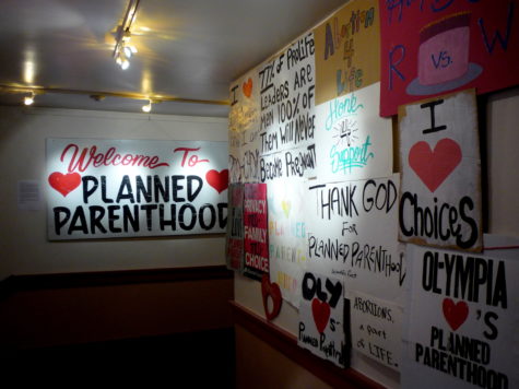 Signs displaying support for Planned Parenthood. By Flickr user Jason Taellious.