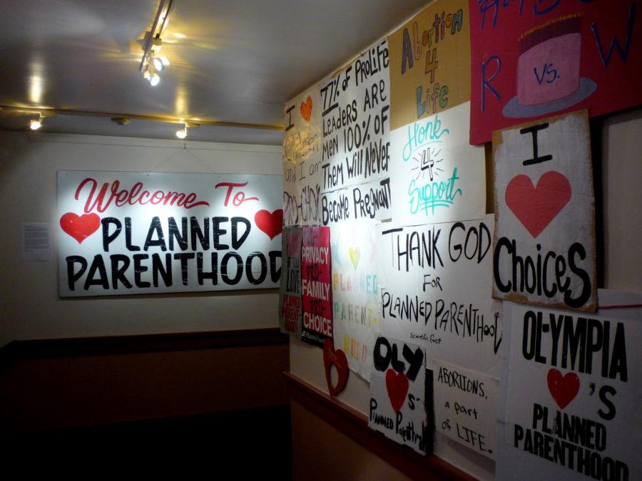 Signs displaying support for Planned Parenthood. By Flickr user Jason Taellious.