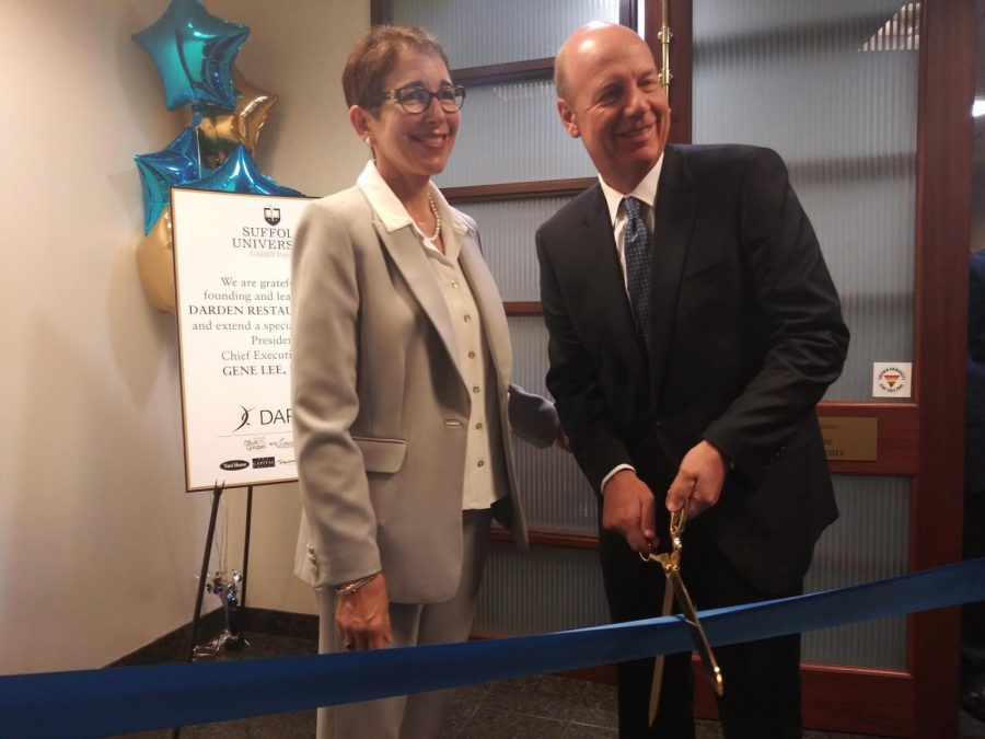 (From left) Marisa Kelly, Suffolk University president, and Gene Lee, president and CEO of Darden Restaurants and SU class of 1996 alumnus, formally open the Suffolk CARES Pantry on the 12th floor of 73 Tremont.
