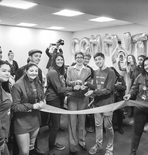 President and Vice President of Commuter Student Council Brian Hatch and Alexa Baugniet cut the ceremonial ribbon with Marisa Kelly, president of Suffolk University 