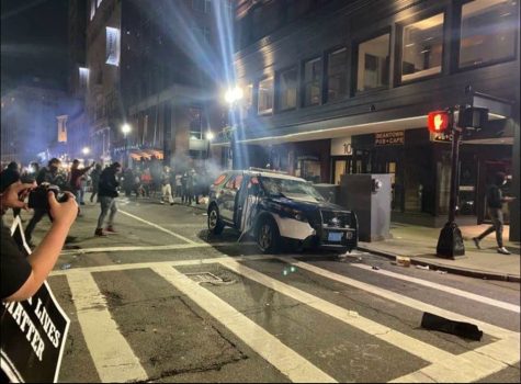 A Boston Police cruiser was set ablaze across the street from 73 Tremont, Suffolk University's administration building that also contains classrooms and the undergraduate library. Crowd's were protesting the death of George Floyd, a black man who was killed in Minneapolis when a police officer kneeled on his neck for about nine minutes.
