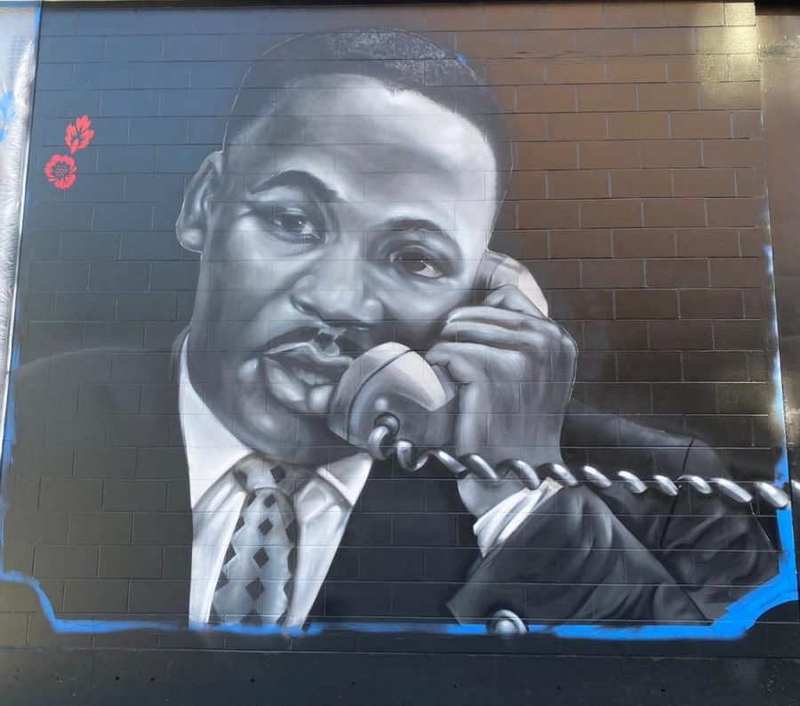 Martin Luther King Jr. depicted in the Roxbury Love Story mural outside the Melnea Residence apartment complex. The mural was painted by local Boston artists Ekua Holmes and Rob Gibbs.