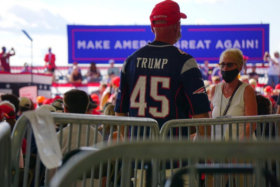 A+man+wears+a+Trump-themed+New+England+jersey+at+a+Trump+rally+in+Londonderry%2C+N.H.%2C+Friday.