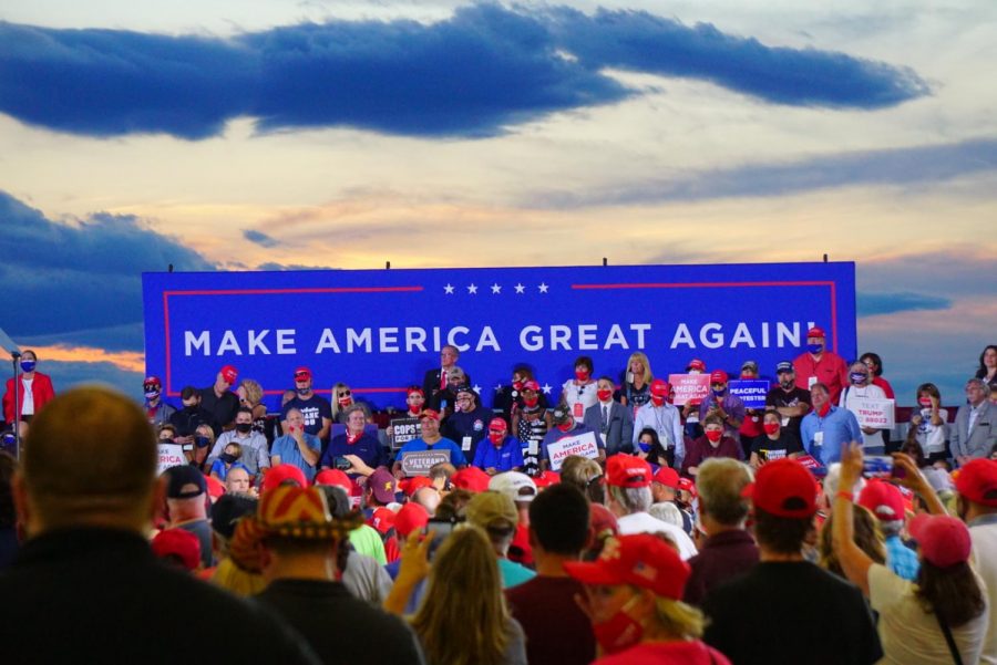 Trump+supporters+sit+on+risers+at+a+Trump+rally+in+Londonderry%2C+N.H.%2C+in+summer+2020.+