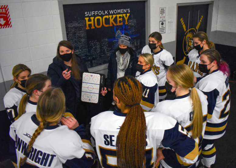 Womens hockey head coach Taylor Wasylk talks strategy to her team before their first game in almost a year 