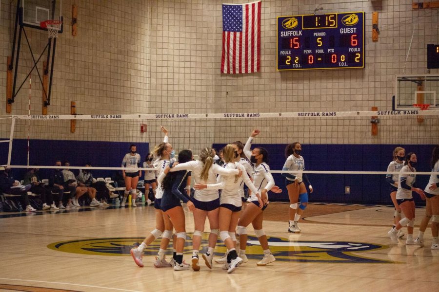 Suffolk+volleyball+celebrates+their+win+over+Lasell+on+Thursday