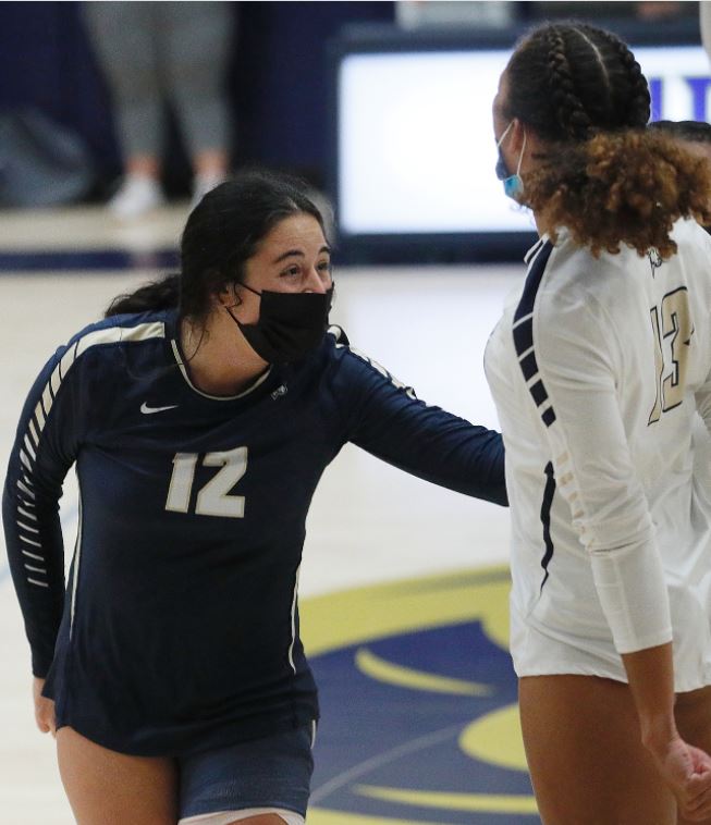Suffolks Kenzley Bell and  Julia Leavey celebrate a score during a match against Lasell on September 16