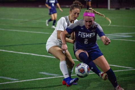 Freshman midfielder Chelsea Fallon fights for possession with Fisher defender.