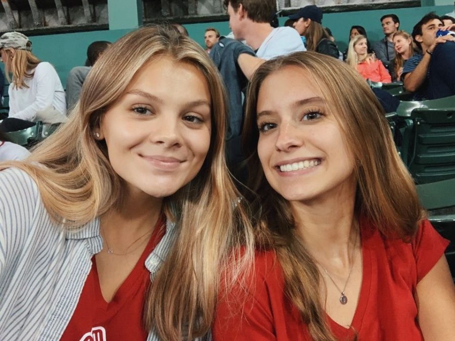 Reagan and her roommate, Suffolk University student Sarah Ross, sitting in the crowd of a Boston Red Sox game.