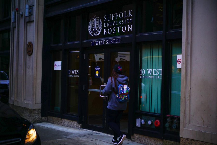 A student walks into Suffolk University's 10 West residential building.