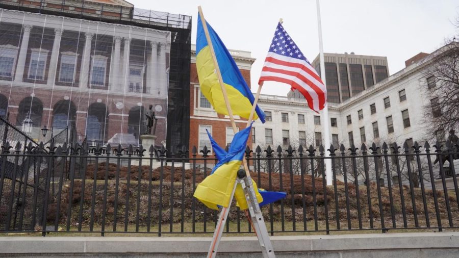 The Ukrainian and American flags are tied together to show the protestors loyalty to both countries.
