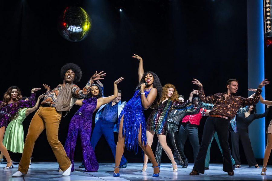 Disco Donna and cast in an energetic performance of the hit Hot Stuff.