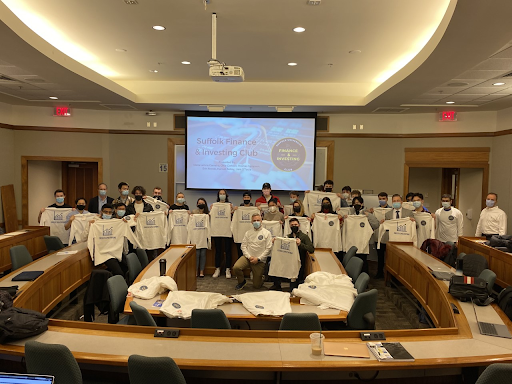 Club members including analysts and e-board holding up their club shirts. The club meets most Tuesdays and Thursdays in Sargent Hall, Room 365.