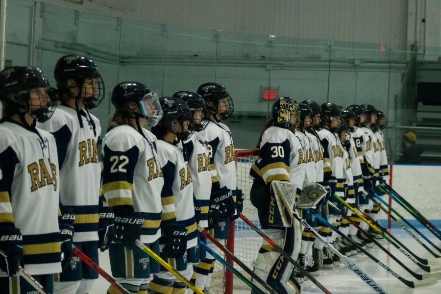 The womens hockey team lines up before their matchup against Curry