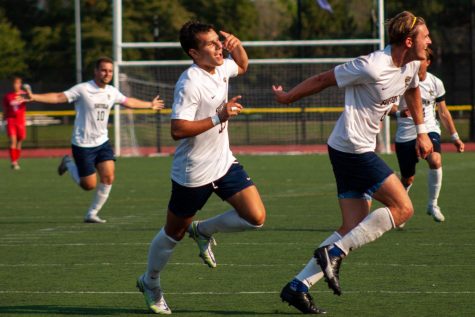 Suffolk Mens soccer celebrates after a goal during their 1-1 draw vs. Emerson.