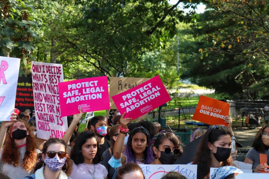 Protesters hold Planned Parenthood signs at Oct. 2 rally