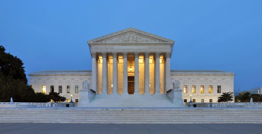 Panorama of United States Supreme Court building at dusk.