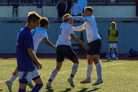 Suffolk’s Trevor Murdock and Brady Sorenson celebrate Sorenson’s game tying goal in double overtime