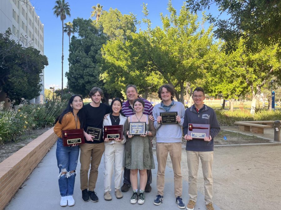 Suffolks Debate Team poses with their awards after a recent tournament at California State University Northridge in Los Angeles.