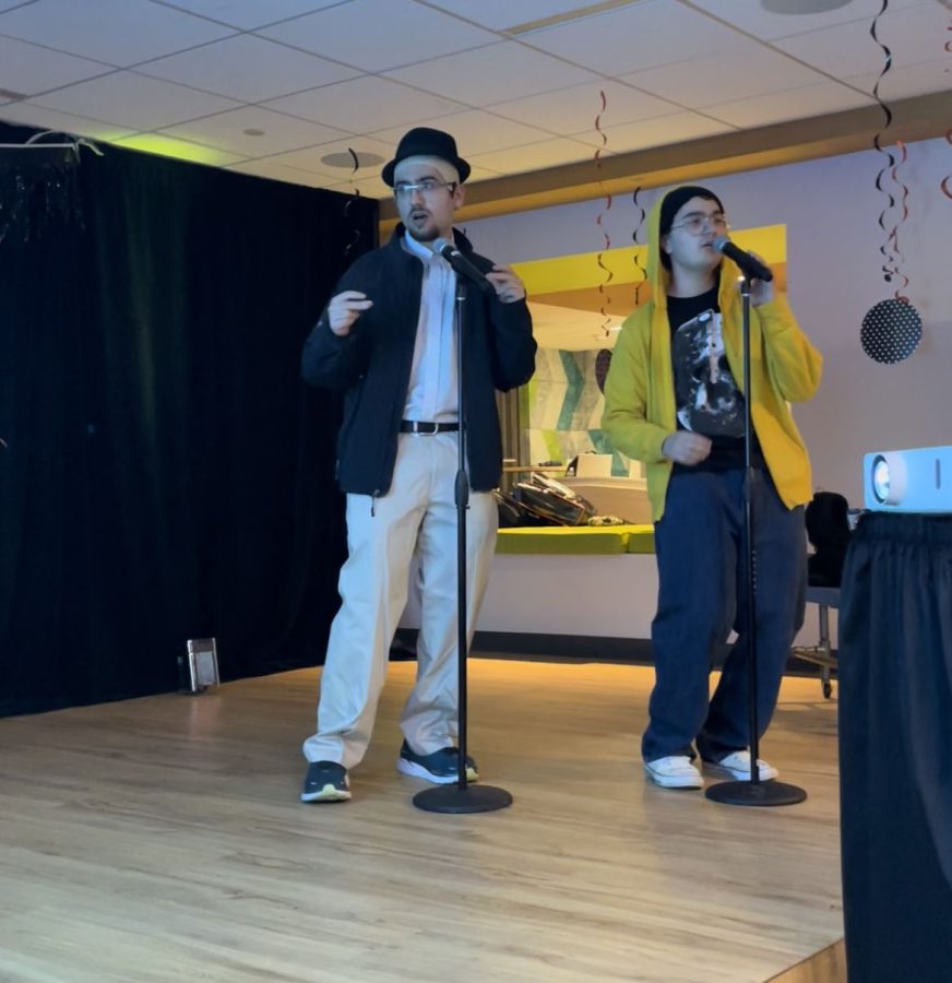 Costumed students sing karaoke at second annual Halloween Karaoke night. 