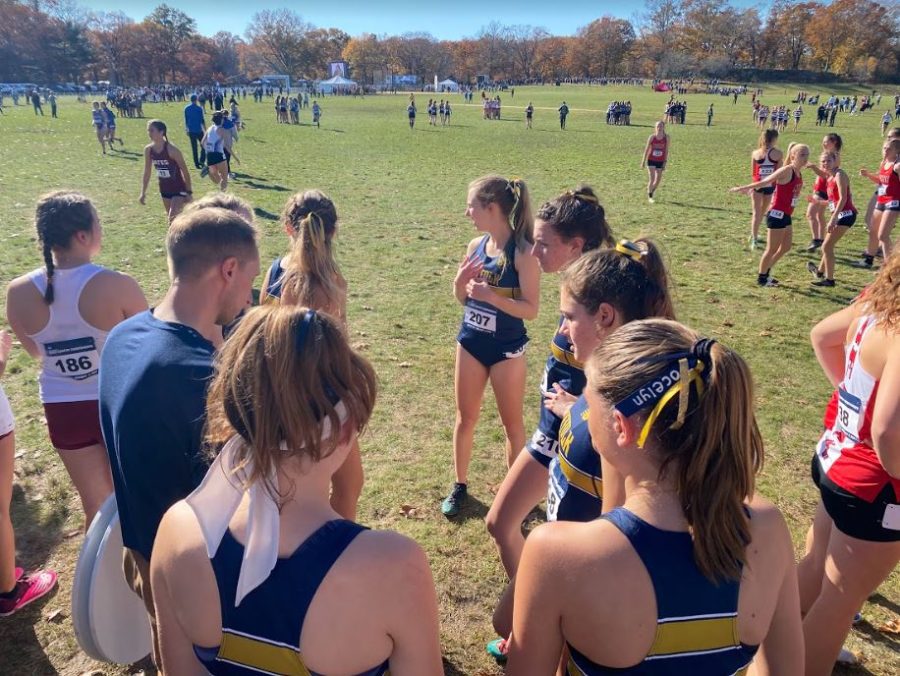 The womens cross country team prepares for their race at last years regionals