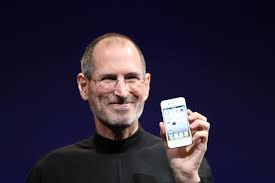 Steve Jobs shows off the iPhone 4 in 2010.