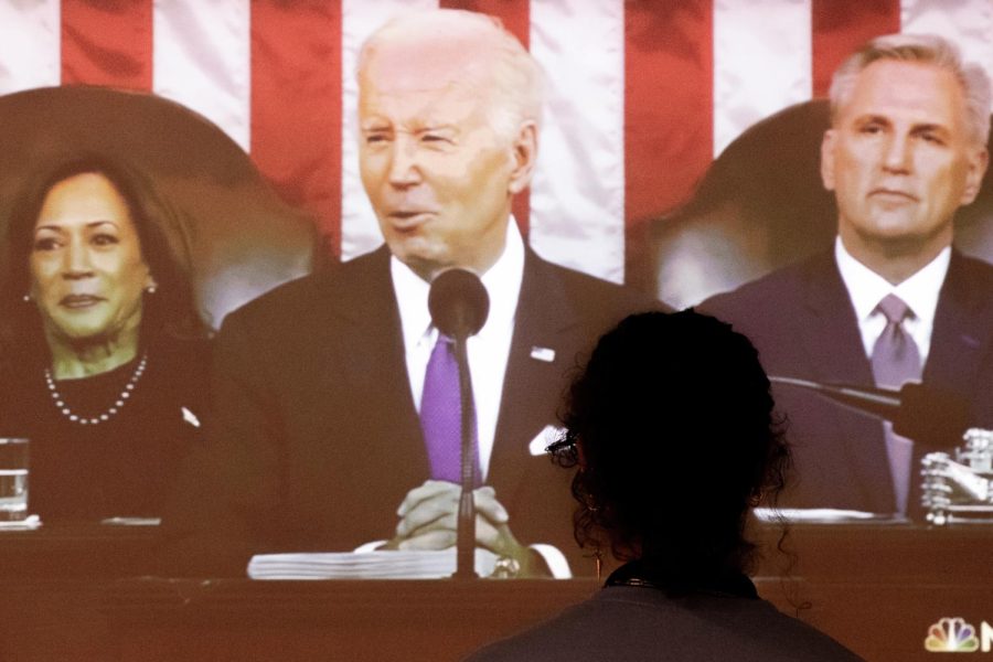A+member+of+The+Suffolk+Journal+watches+Biden+give+the+State+of+the+Union+address.