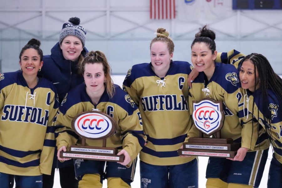Head coach Taylor Wasylk and the remaining players of the inaugural womens hockey team.