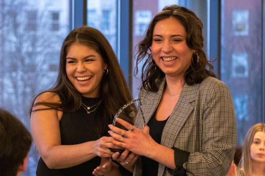 Ashleigh Bautista (left) and Celia Mendoza (right) celebrate after Pasion Latina wins the SGA award for Outstanding Student Organization of the Year.