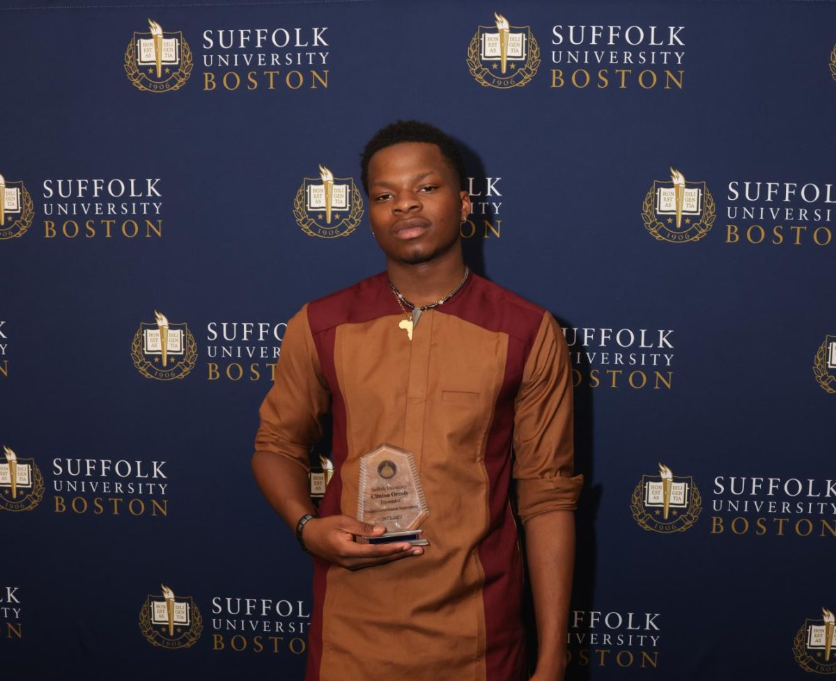 Clinton+Oreofe+poses+with+his+award+for+serving+as+SGA+Treasurer+at+the+2023+SGA+Awards.+Oreofe+was+elected+to+serve+as+SGA+President+for+the+upcoming+academic+year.