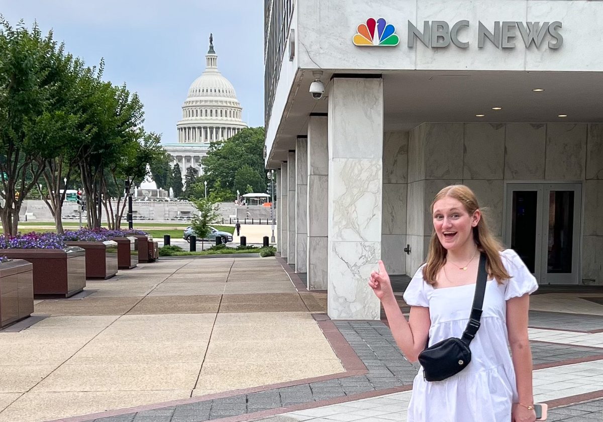 Stanton+points+at+the+U.S.+Capitol+outside+of+NBC+News.+Courtesy+of+Shannon+Stanton