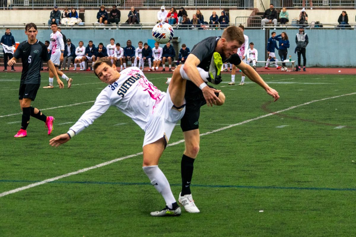 Sophomore midfielder Carter Van Buskirk clashes with a Nichols player in pursuit of a bouncing ball. The Rams had a 1-1 draw with the Bison Oct. 7.
