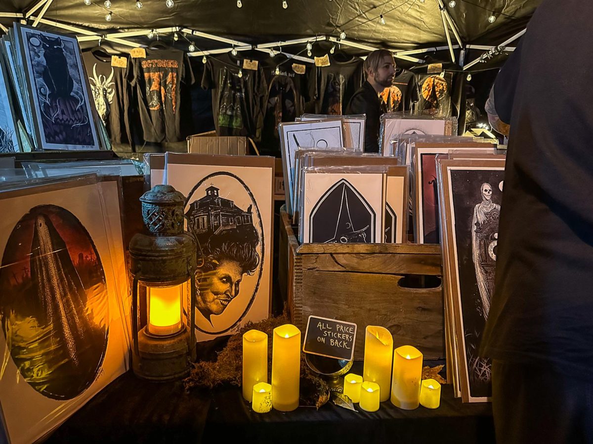 The founders of the faire, Black Veil Studio, hosted a booth selling artwork and t-shirts to eager visitors.