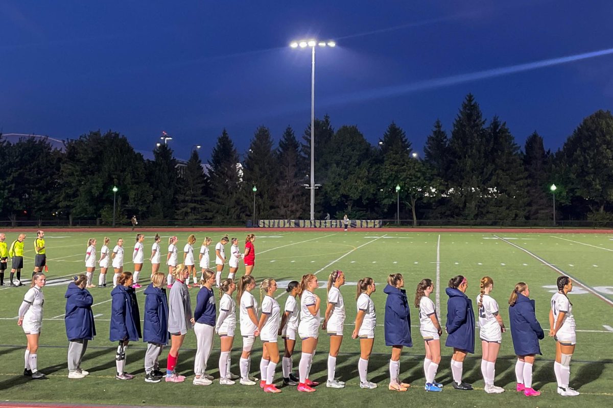 Suffolk womens soccer team lined up for the national anthem ahead of their game vs Fisher College on Sept. 26.