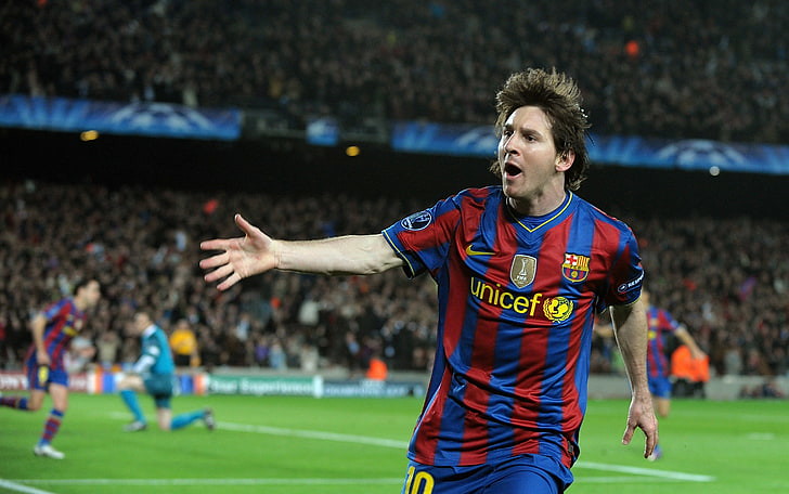 Lionel Messi celebrating during a game while playing for Barcelona FC.