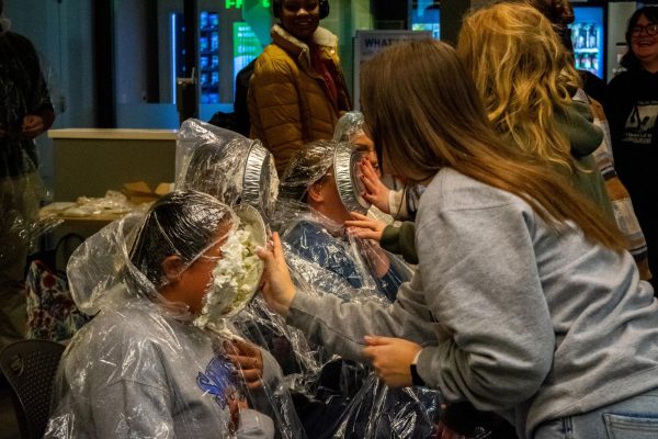 Suffolk students pie faculty and staff to benefit Alternative Spring Break.