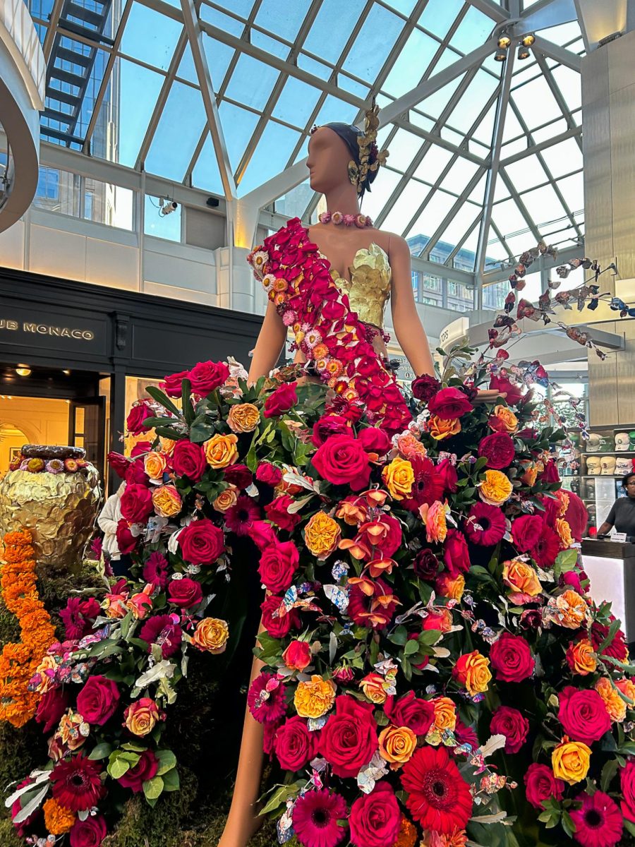 Mannequins covered from head to toe in fresh cut flowers fill Prudential Center with life.