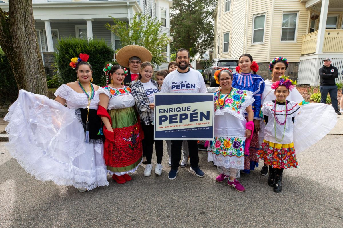 Enrique Pepén poses with Boston residents during his City Council campaign.