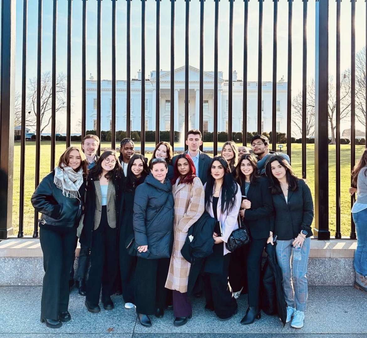 Suffolk students pose for a picture in front of the White House in Washington D.C. Courtesy of Swara Gurau.