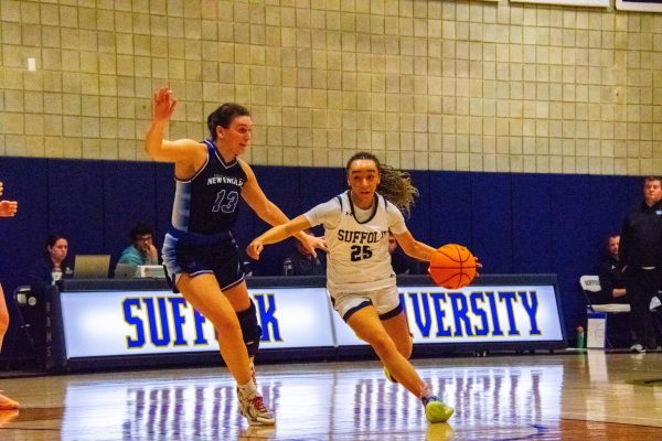 Freshman guard Ava Thurman drives to the basket during a game against the University of New England Jan. 4.