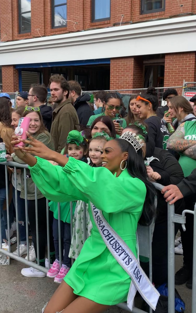 Sapini stops to take selfies with onlookers of the Boston St. Patrick’s Day parade.