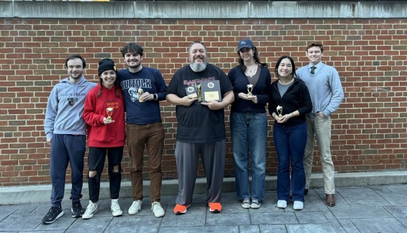 Suffolk University Debate Team poses with their awards after the national conference in Morgantown, West Virginia. Courtesy of Juliette Salah.