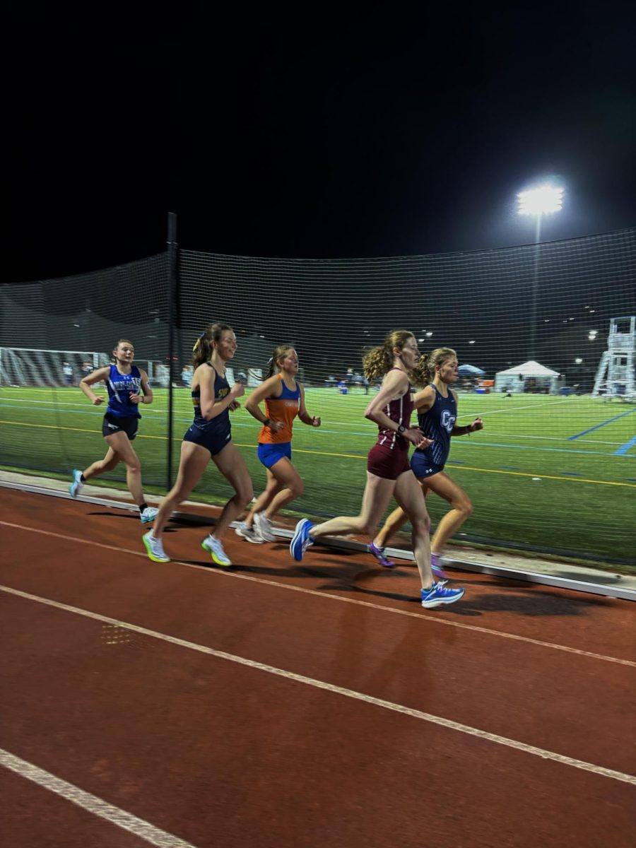 Suffolk University senior and News Editor of The Suffolk Journal Sarah Roberts racing the 10k at Connecticut Colleges Silfen Invitational April 12.