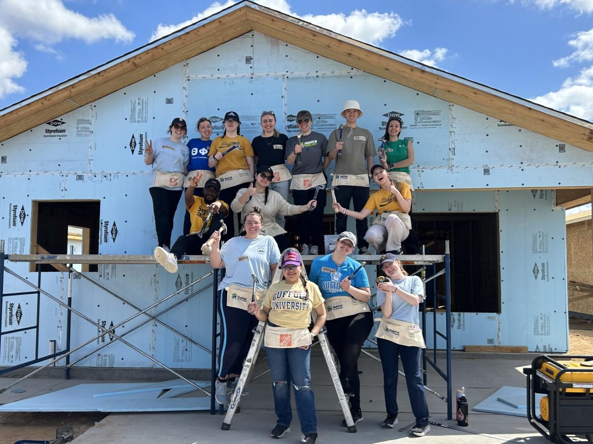 Students on the trip to Laredo, Texas work with Habitat for Humanity to build a house in the community on the U.S.-Mexico Border. | Courtesy of Raffaella Shanahan.