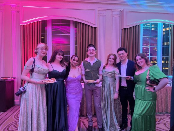 From left to right: Sophia Tilis, Emily Corrao, Ana Manzioli, Ian McKissick, Emily Zeigerson, Andy Dolci and Isabel Blanco pose for a picture at Spring Ball.
