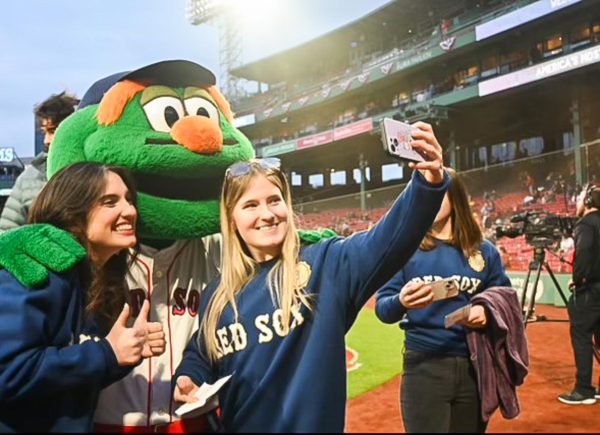 From left to right Julia Valanzola and Avery Jipping posing with Wally the Green Monster. 